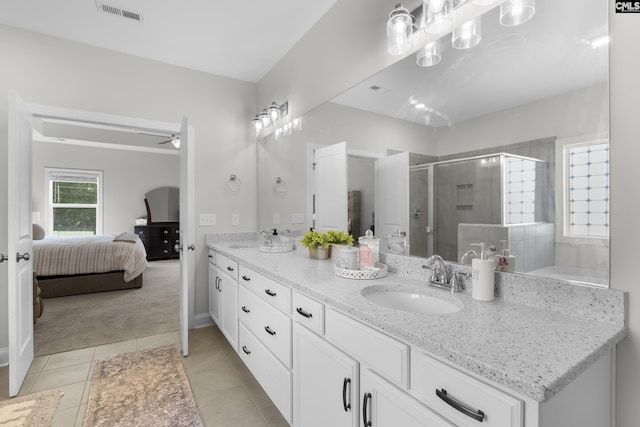 309 Springbrook Way, Chapin, SC 29036 - full bathroom featuring ensuite bathroom, double vanity, a shower stall, ceiling fan, and tile patterned flooring