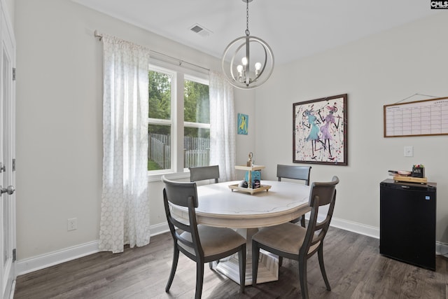 309 Springbrook Way, Chapin, SC 29036 - dining space featuring a chandelier, dark wood-style floors, and baseboards