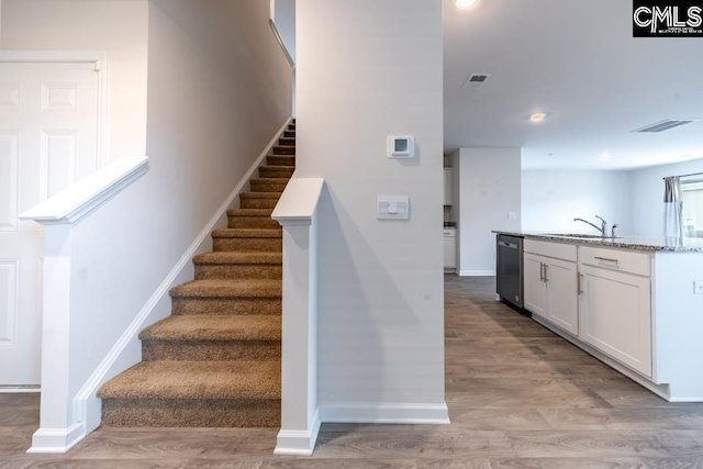 158 Dunham Rd, Columbia, SC 29209 - stairway featuring baseboards, wood finished floors, and recessed lighting