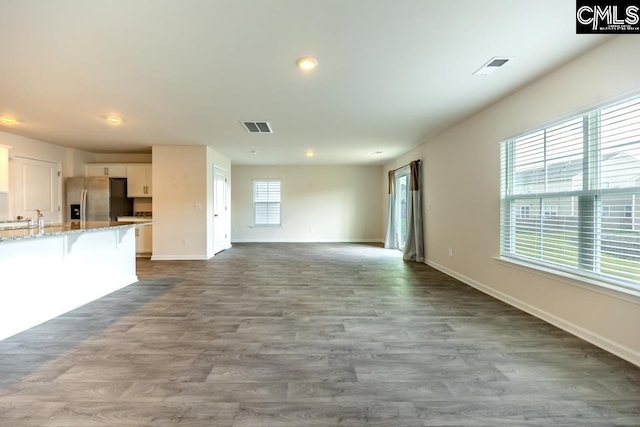 158 Dunham Rd, Columbia, SC 29209 - unfurnished living room with baseboards, dark wood-style floors, recessed lighting, and a sink