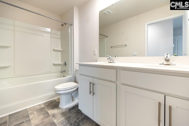 158 Dunham Rd, Columbia, SC 29209 - bathroom featuring double vanity, toilet, shower / tub combination, and stone finish floors