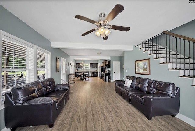 1122 Rawl Rd, Lexington, SC 29072 - living room featuring wood finished floors, ceiling fan, beam ceiling, stairway, and baseboards