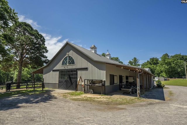 1122 Rawl Rd, Lexington, SC 29072 - view of front of house featuring an outdoor structure, a garage, dirt driveway, and an exterior structure