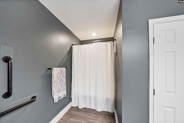 1122 Rawl Rd, Lexington, SC 29072 - full bath with wood finished floors, baseboards, and a shower with curtain