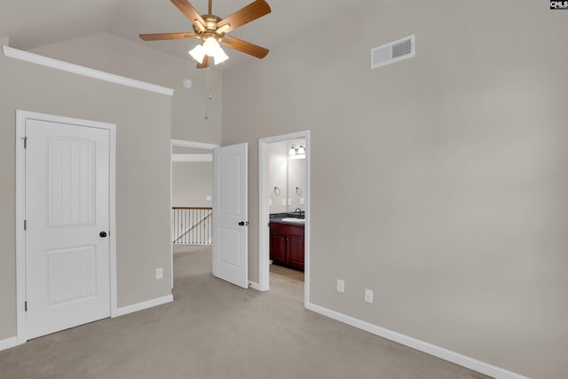 506 Moulton Way W, Columbia, SC 29170 - unfurnished bedroom with a sink, light carpet, high vaulted ceiling, baseboards, and connected bathroom