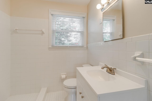 6319 Briarwood Rd, Columbia, SC 29206 - full bath with tile walls, toilet, vanity, a tile shower, and wainscoting