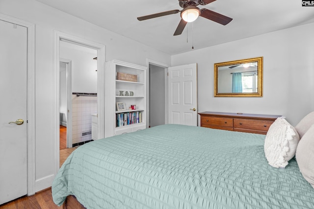 564 Rainbow Cir, West Columbia, SC 29170 - bedroom featuring wood finished floors, a ceiling fan, and connected bathroom