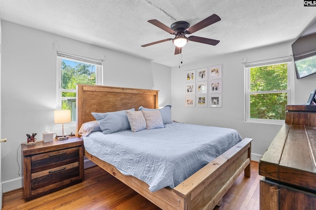 564 Rainbow Cir, West Columbia, SC 29170 - bedroom featuring hardwood / wood-style floors, a textured ceiling, baseboards, and a ceiling fan