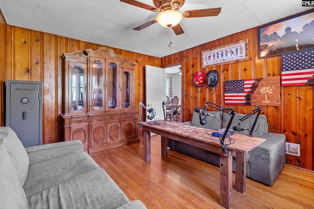 564 Rainbow Cir, West Columbia, SC 29170 - office area featuring ceiling fan, wooden walls, a textured ceiling, and light wood-style flooring