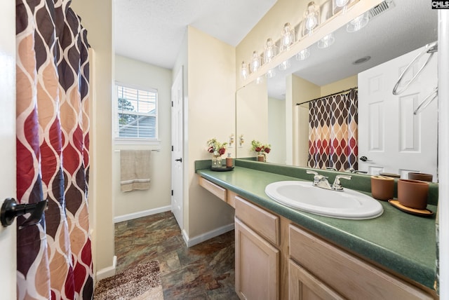 5 Indigo Lake Ct, Columbia, SC 29229 - bathroom featuring stone finish flooring, vanity, baseboards, and curtained shower