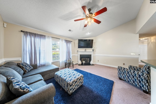 5 Indigo Lake Ct, Columbia, SC 29229 - carpeted living area with ceiling fan, a fireplace with flush hearth, vaulted ceiling, baseboards, and a textured ceiling