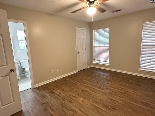 26 Someton Ct, Irmo, SC 29063 - unfurnished room with ceiling fan, baseboards, dark wood-type flooring, and a textured ceiling