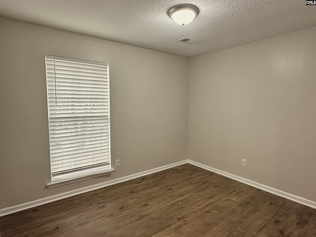26 Someton Ct, Irmo, SC 29063 - spare room with dark wood-type flooring, a textured ceiling, and baseboards