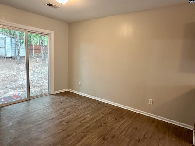 26 Someton Ct, Irmo, SC 29063 - spare room with baseboards and dark wood-style floors