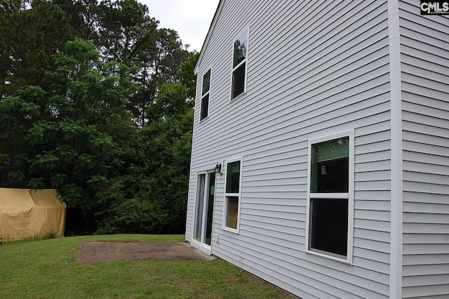 525 Eastfair Dr, Columbia, SC 29209 - view of side of home featuring a lawn and a patio