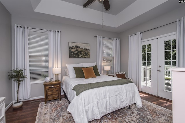 615 Laurel Hill Ln, Columbia, SC 29201 - bedroom featuring french doors, access to exterior, wood finished floors, and a tray ceiling