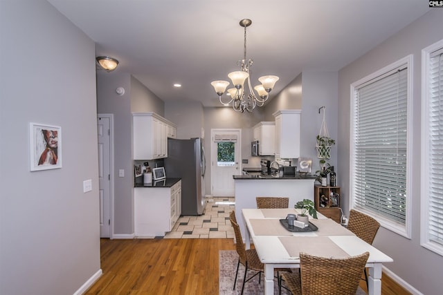 615 Laurel Hill Ln, Columbia, SC 29201 - dining space featuring a chandelier, light wood-style flooring, baseboards, and recessed lighting