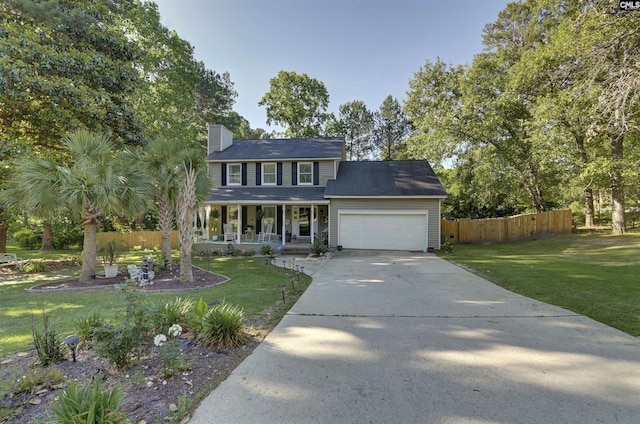 213 Windwood Dr, Elgin, SC 29045 - colonial-style house featuring a porch, concrete driveway, an attached garage, and a chimney