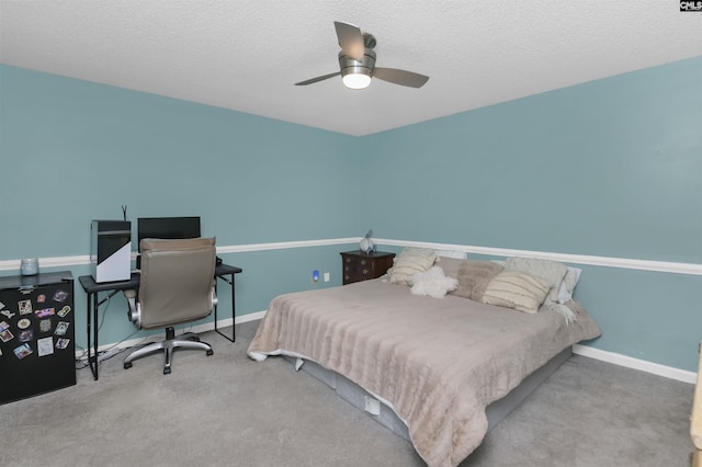 213 Windwood Dr, Elgin, SC 29045 - carpeted bedroom with an office area, a ceiling fan, baseboards, and a textured ceiling