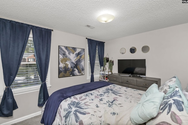 213 Windwood Dr, Elgin, SC 29045 - bedroom with a textured ceiling, carpet, and baseboards
