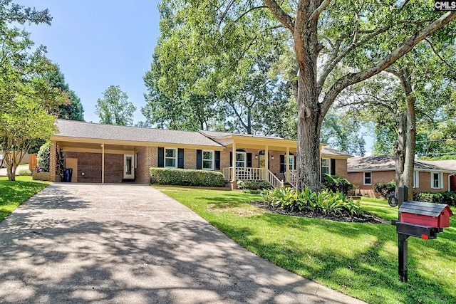 225 King Charles Rd, Columbia, SC 29209 - ranch-style house with driveway, brick siding, a front yard, and an attached carport