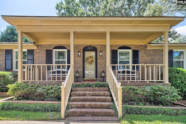 225 King Charles Rd, Columbia, SC 29209 - view of front of house with a porch and brick siding