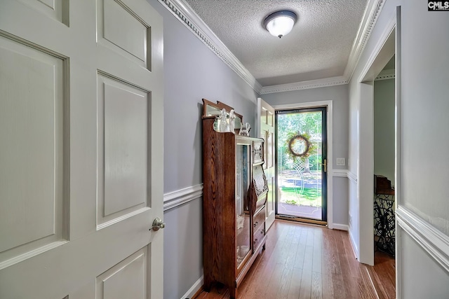 225 King Charles Rd, Columbia, SC 29209 - entrance foyer featuring a textured ceiling, wood-type flooring, and ornamental molding