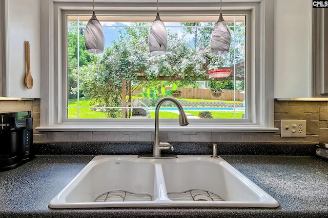 225 King Charles Rd, Columbia, SC 29209 - kitchen view of a sink, dark countertops, and backsplash