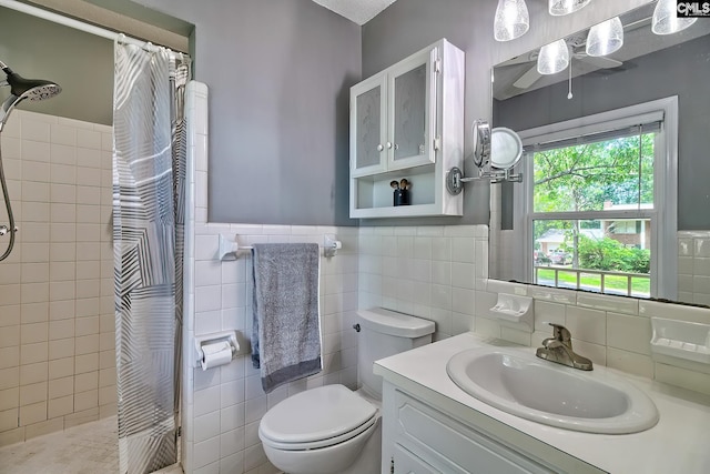 225 King Charles Rd, Columbia, SC 29209 - bathroom with tile walls, tiled shower, toilet, vanity, and ceiling fan