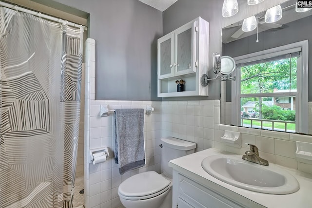225 King Charles Rd, Columbia, SC 29209 - full bath featuring tile walls, toilet, vanity, a shower with curtain, and ceiling fan