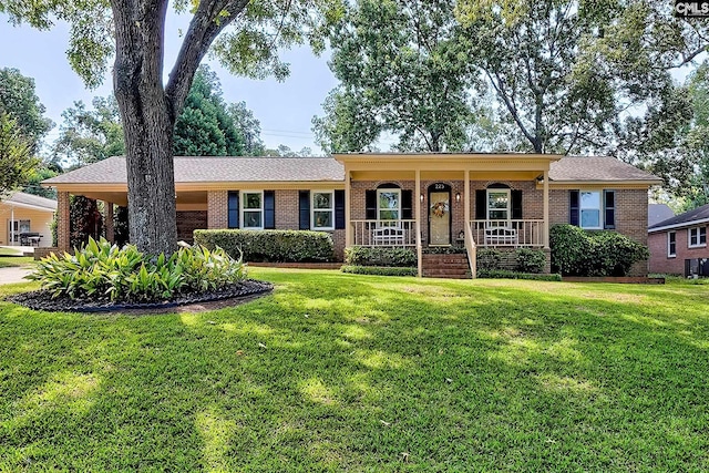 225 King Charles Rd, Columbia, SC 29209 - single story home featuring a porch, brick siding, a front lawn, an attached carport, and central AC unit