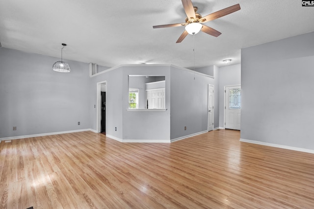 140 Whispering Glen Cir, West Columbia, SC 29170 - unfurnished room with a ceiling fan, light wood-style floors, baseboards, and a textured ceiling