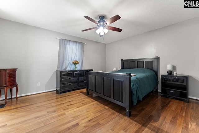 6304 Christie Rd, Columbia, SC 29209 - bedroom with wood finished floors, baseboards, and a ceiling fan