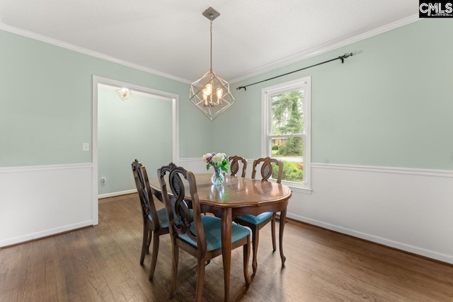 6304 Christie Rd, Columbia, SC 29209 - dining area featuring wood finished floors, ornamental molding, a chandelier, and baseboards