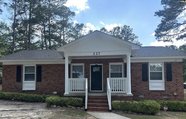 227 Flora Dr, Columbia, SC 29223 - view of front of property with brick siding, covered porch, and a shingled roof