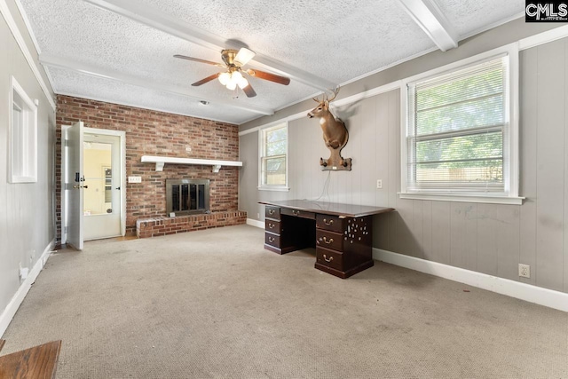 200 Shady Ln, Cayce, SC 29033 - unfurnished living room featuring a textured ceiling, ceiling fan, carpet, a brick fireplace, and baseboards