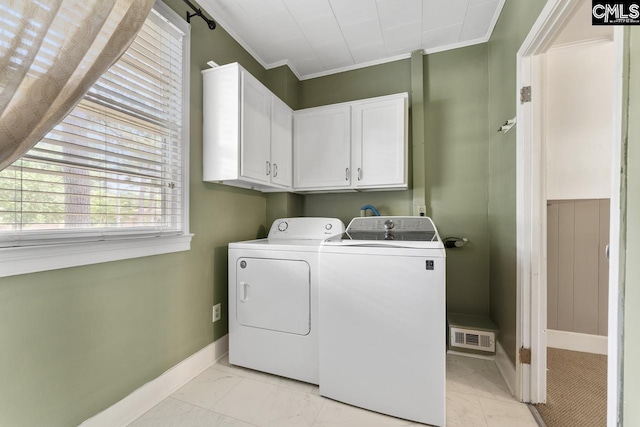 200 Shady Ln, Cayce, SC 29033 - washroom featuring cabinet space, separate washer and dryer, baseboards, crown molding, and light marble finish floors