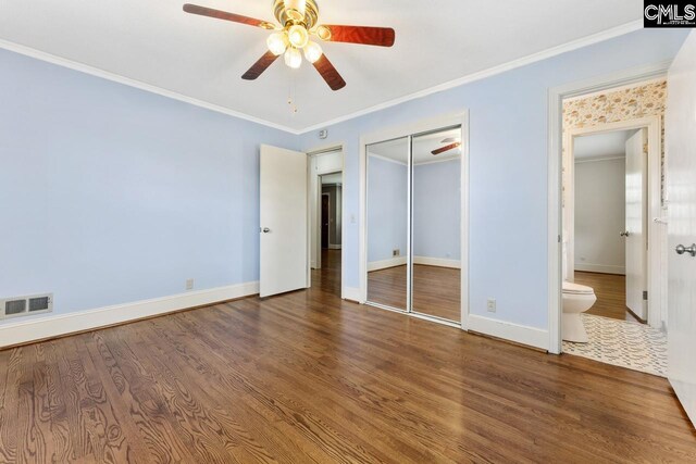 200 Shady Ln, Cayce, SC 29033 - unfurnished bedroom featuring wood finished floors, baseboards, crown molding, a closet, and a ceiling fan