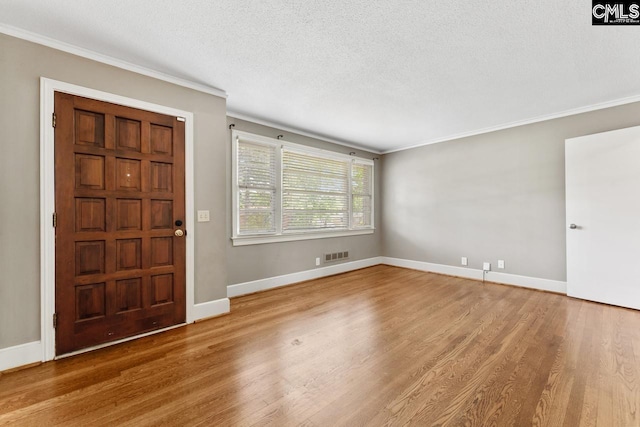 200 Shady Ln, Cayce, SC 29033 - entryway with ornamental molding, wood finished floors, a textured ceiling, and baseboards