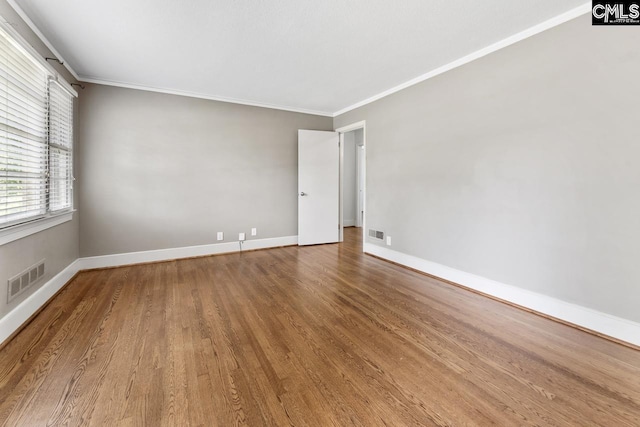 200 Shady Ln, Cayce, SC 29033 - spare room with wood finished floors, ornamental molding, and baseboards