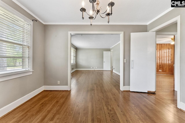 200 Shady Ln, Cayce, SC 29033 - unfurnished dining area featuring a chandelier, wood finished floors, crown molding, and baseboards