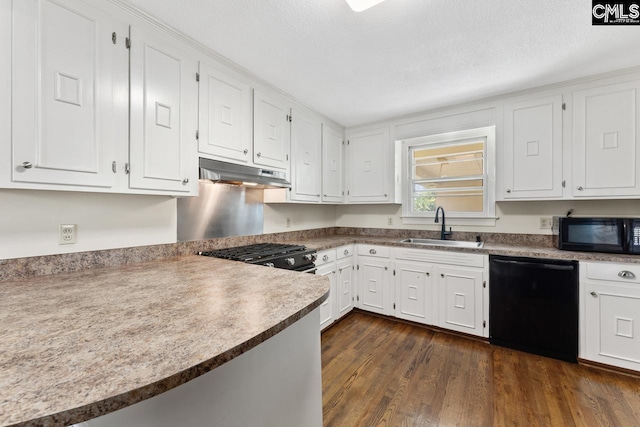 200 Shady Ln, Cayce, SC 29033 - kitchen with black appliances, under cabinet range hood, a sink, white cabinets, and dark wood-style flooring
