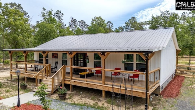 735 Fletcher Dr, Kershaw, SC 29067 - view of front of home featuring metal roof, a deck, and crawl space