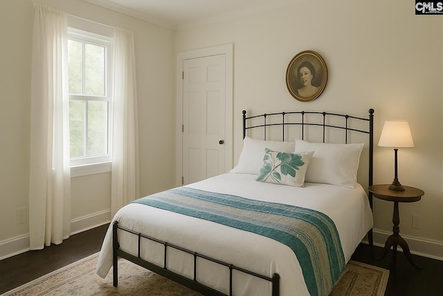 2336 Park St, Columbia, SC 29201 - bedroom with baseboards, dark wood finished floors, and ornamental molding