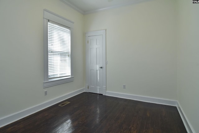 2336 Park St, Columbia, SC 29201 - spare room with dark wood-style floors, baseboards, ornamental molding, and healthy amount of natural light
