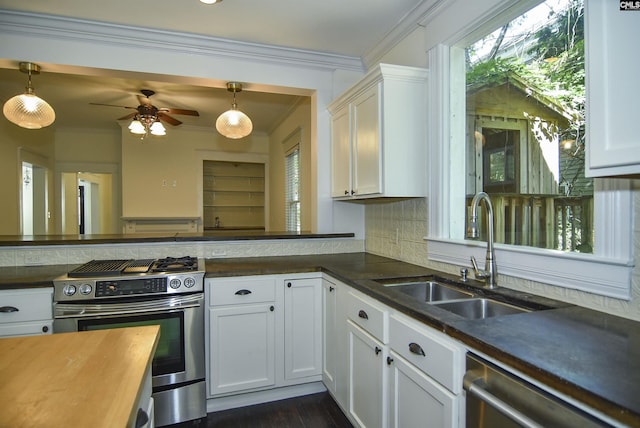 2336 Park St, Columbia, SC 29201 - kitchen featuring stainless steel appliances, a sink, a ceiling fan, tasteful backsplash, and ornamental molding
