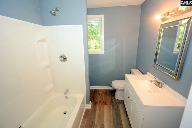 4257 Donavan Dr, Columbia, SC 29210 - full bath featuring wood finished floors, toilet, vanity, shower / washtub combination, and baseboards