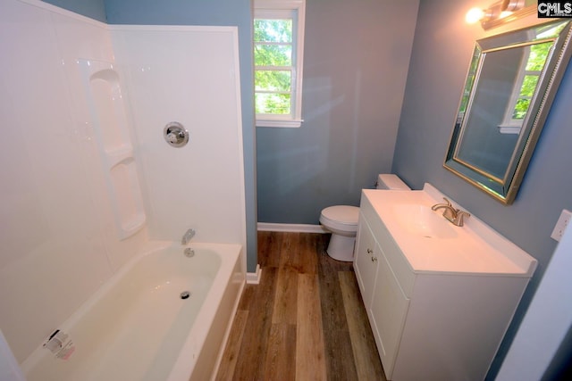 4257 Donavan Dr, Columbia, SC 29210 - bathroom with wood finished floors, vanity, baseboards, toilet, and bathing tub / shower combination