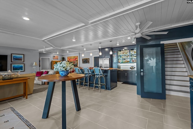 132 Magnolia Key Dr, Chapin, SC 29036 - dining space featuring ceiling fan, light tile patterned floors, bar area, recessed lighting, and stairs
