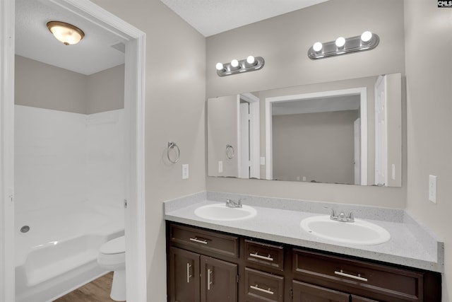 220 Colchester Dr, Columbia, SC 29223 - full bath with double vanity, toilet, wood finished floors, and tub / shower combination